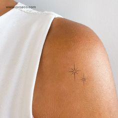 a woman with a small star tattoo on her back shoulder, showing it's cross section