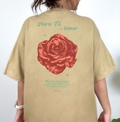 "Aesthetic Shirt with Rose, Vintage Rose shirt, Beautiful flower shirt, retro rose streetwear shirt, Para Ti Amor by Push For More Hi! Welcome to my store! Thanks for the support! Para Ti, Amor, with design on front and back! Designed with Love An illustrated rose paired with a love note written in Spanish. That reads \" Mientras los peddles aguantan, con fuerza y paciencia, unable flor maestro su belleza. Me acuerdo de ti, de tu alma y de tu corazón\". A timeless pair. Wear it as a statement pi Thanks For The Support, Rose Shirts, Streetwear Shirts, Aesthetic Shirt, Red Team, Love Note, Aesthetic Shirts, Rose Vintage, Flower Shirt