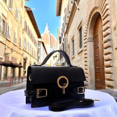 This bag has been made of the best genuine leather by local master crafters of Florence in Italy, designed for women who only accept premium Italian quality and luxury leather bags and modern Italian fashion. . Sizes: Width: 24 cm / 9.45 inches Height: 14 cm / 5.51 inches Depth: 6.30 cm / 2.48 inches Color: Black . The Story Of This Bag: In the heart of Florence, where history and art converge in a tapestry of timeless beauty, there exists a boutique renowned for its exquisite Italian handmade l Luxury Italian Satchel Shoulder Bag, Luxury Soft Leather Black Box Bag, Luxury Black Soft Leather Box Bag, Black Rectangular Flap Bag With Leather Lining, Black Top Handle Flap Bag With Leather Lining, Luxury Black Leather Flap Bag, Elegant Black Leather Box Bag, Black Flap Bag With Leather Lining For Office, Modern Black Flap Bag With Leather Lining