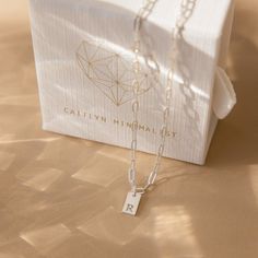 Pretty, dainty and totally adorable! Introducing our Mini Initial Paperclip Necklace, a stylish and personalized accessory that adds an understated and fun touch to your outfit. Crafted with meticulous attention to detail, this necklace features a mini tag that can be engraved with your desired letter or symbol. The contemporary paperclip chain design adds a modern twist, making it a versatile piece for daily wear or special occasions. Material: High Quality Solid 925 Sterling Silver Finish: Ste Simple Paperclip Chain Necklace Gift, Simple Paperclip Chain Necklace As Gift, Minimalist Paperclip Necklace As Gift, Minimalist Paperclip Necklace For Gift, Trendy Personalized Everyday Charm Necklace, Trendy Sterling Silver Charm Necklace As A Gift, Trendy Adjustable Initial Necklace Gift, Trendy Initial Necklace For Mother's Day Gift, Minimalist Everyday Charm Necklace With Lobster Clasp