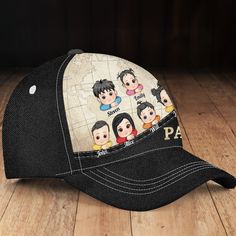 a baseball cap with an image of the cast of avatars on it sitting on a wooden floor