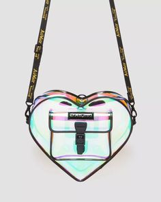 Dr Martens Crafted from durable, iridescent PU, this transparent heart-shaped backpack features branded black hardware and AirWair straps. The iridescent material has a distinctive shine and is transparent, allowing for a unique and eye-catching look. Its dimensions are: Length - 11.5", Height - 10", Depth - 3". Cherry Sundae, Keep Your Heart Open, Heart Bags, Heart Backpack, Transparent Backpack, Transparent Heart, Heart Purse, Heart Shaped Bag, Chelsea Boots Heel