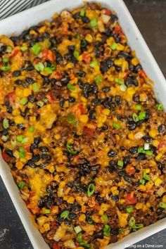 a casserole dish filled with black beans and corn