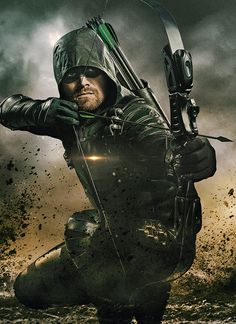 the arrow man is holding his bow and aiming