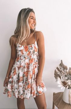 our dreama dress is the cutest babydoll style mini featuring a white base and orange, peach & olive toned floral print. this lightweight & relaxed style mini features feminine micro frill detailing on the skirt and tie up strap detailing. tullie is 163 cm tall, and has an 85 cm bust, 64 cm waist, & 85 cm hips. she is wearing an xs/ au 6 / us 2. this dress is true to size. simone is 164 cm tall, and has a 78 cm bust, 60 cm waist, & 88 cm hips. she is wearing an xs/ au 6 / us 2. key features: rela Aesthetic Dresses Casual, Dainty Dresses, English Project, Summertime Outfits, Anniversary Pictures, Summer Trends Outfits, Amazing Clothes, Perfect Closet, Orange Print