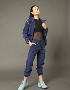 Track pants are made for people who desire to be better version of themselves. Very breathable in summer weather and windproof during windy season. Available in black and navy colorway. Pockets on side seam, Side waist elastic for more room, Metal hook and bar Side lapped zipper on legs 100% NYLONmesh pocket:100% POLYESTERDELICATE MACHINE WASHSize Guide:Male model is 185cm tall and wearing size S fit to waist 30Female model is 173cm tall and wearing size S fit to waist 30 Navy Athleisure Bottoms For Outdoor, Sporty Pants With Elastic Cuffs For Outdoor, Navy Athleisure Pants With Pockets, Sporty Navy Nylon Pants, Sporty Ankle-length Outdoor Pants, Sporty Parachute Pants With Elastic Cuffs For Outdoor, Navy Nylon Bottoms For Outdoor, Sporty Navy Bottoms For Outdoor, Casual Navy Nylon Pants