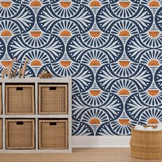 a blue and orange wallpaper with sunbursts in the background, next to wicker baskets