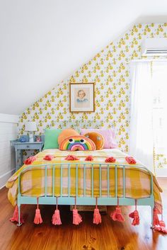 a bed with yellow and green sheets in a room