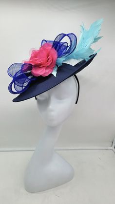 Beautiful large blue fascinator adorn with sky blue feathers and and hot pink  flowers. Style to go with a variety of outfits: bridesmaids,  cocktail party,  Kentucky Derby, Rehearsal dinner, Easter and church outfits.  Ones with hair clip and headband. Are you trying to match an outfit? Send a picture and I will help you find a best hat to match your outfit.  - Rare find - Ready to ship  - Lightweight - Free Shipping - Fast shipping - Customize by adding different color flowers and or feathers Check my store for for styles and colors.  etsy.com/shop/hatsandpearls Find more at my website: Www.hatsandpearls.com  reach out to me if you can't find what you are looking for.  I can make cake custom orders and help you style and match your outfit  Thank you for visiting! Blue Mini Hats With Handmade Flowers For Royal Ascot, Spring Blue Fascinator For Garden Party, Blue Spring Fascinator For Garden Party, Spring Blue Mini Hats With Handmade Flowers, Summer Blue Headpiece With Handmade Flowers, Blue Feather Trim Fascinator For Kentucky Derby, Blue Fascinator With Handmade Flowers For Kentucky Derby, Blue Fascinator For Royal Ascot Garden Party, Blue Fascinator For Garden Party And Royal Ascot