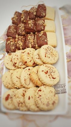 a plate full of cookies and crackers on a table