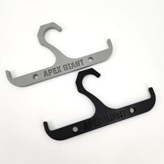 two black and silver wrenches with apex giant logo on the front one has an apex giant logo on the back