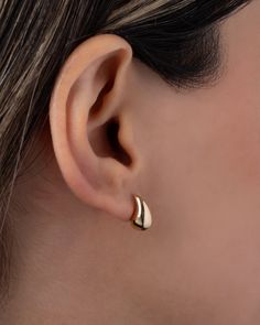 The perfect accessory for every occasion, these 14K Gold Small Teardrop Stud Earrings add a touch of luxury to any ensemble. From a strapless gown to a classic white tee, these earrings elevate your style with their curvaceous, bubbly design. Effortless and feminine, they are a trendy must-have for the fashion-forward woman. Size: Approx. 6mm(W) x 12mm(H) Total Weight: Approx. 1.37 grams (per pair) Standard Production: 2-5 business days Rush Order Production: 1-3 business days Shipping: Select s Classic Teardrop Huggie Earrings For Wedding, Elegant Huggie Earrings For Wedding, Classic Teardrop Huggie Earrings In 14k Gold, Classic Teardrop 14k Gold Huggie Earrings, Classic Teardrop Huggie Earrings For Gift, Elegant Tarnish Resistant Huggie Earrings For Anniversary, Elegant Huggie Earrings, Elegant 14k Gold Huggie Earrings For Formal Wear, Elegant 14k Gold Huggie Earrings For Formal Occasions