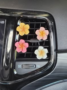 flowers are placed on the center console of a car