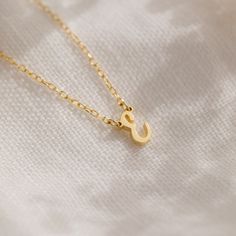 Presenting our Minimalist Initial Necklace, a personalized accessory that adds a touch of charm to any ensemble ♡ Crafted with love and attention to detail, this necklace features a dainty pendant adorned with your chosen initial, making it a perfect gift to celebrate individuality and style! Material: High Quality Solid 925 Sterling Silver Finish: Sterling Silver ∙ 18K Gold ∙ Rose Gold Dimensions: ~7mm letter height Model showcases a dainty, everyday layering look featuring our Chelsea Duo Ring Initial Tag Necklace, Dainty Initial Necklace, Dainty Pendant, Bar Bracelets, Birthstone Necklace, Pearl Drop Earrings, Birthstone Ring, Silver Roses, Silver Rose Gold