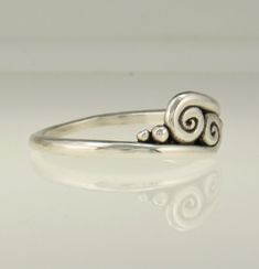 Sterling Silver Scroll Ring/ Silver Wave Ring/ Double Swirl Ring/ Silver Swirl Ring/ One of a Kind Ring/ Silver Thumb Ring/ Handmade Ring R1198- Sterling Silver Handmade One of a Kind ring. The scrolls or swirls give it a Victorian or Egyptian feel. Comfortable Low Profile One of a Kind Ring. It is a size 9. I can size it to fit, just contact me. No charge to size down, and no charge for one size up. Would make a nice Thumb Ring. The top of the ring measures 8 mm and the band is 2 mm. This ring Unique Spiral Rings For Anniversary, Spiral Sterling Silver Wedding Ring, Elegant Sterling Silver Ring With Artistic Design, Modern Twist Swirl Ring For Gift, Modern Twist Swirl Ring As Gift, Modern Twist Swirl Ring For Gifts, Sterling Silver Swirl Rings For Gift, Unique Swirl Rings For Anniversary, Thumb Rings Silver