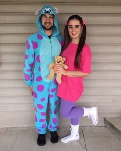 a man and woman dressed up in costumes