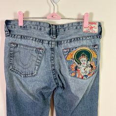 > Size: 29 > Preowned, Great Condition ( Please See All Pictures For Information) > Material Content & Fabric Care ( See Pictures) > Low Rise > Boot Cut > Zip & Button Closure > Belt Loops > 5 Pocket Style > Embroidered Back Pocket > Vintage Approx. Measurements Laying Flat: > Front Rise: 7 1/2” > Inseam:33” Embroidered Jeans For Streetwear, Casual Denim Bottoms With Embroidered Patch, Boot Cut Denim, True Religion Jeans, True Religion, Colored Jeans, Jeans And Boots, Boot Cut, Fabric Care