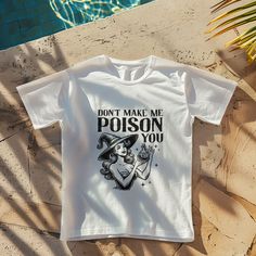 a t - shirt that says, don't make me poison you