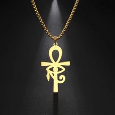 The ankh is an ancient Egyptian symbol that was most commonly used in writing to represent the word for "life" and, by extension is a symbol for life. This ankh necklace is made of solid 316L surgical stainless steel and has a high polish gold color PVD finish with the eye of Ra or Horus in the center. This amulet is reversible so that it may be worn as the eye of Ra or Horus. The Eye of Ra is a symbol of the sun. It is personified by several Egyptian goddesses, such as Wadjet, Sekhmet, Hathor, Egyptian Amulet, Ankh Necklace, Egyptian Inspired, Black Unicorn, Baby Black, Child Baby, Mens Jewelry Necklace, Eye Of Horus, Trendy Necklaces