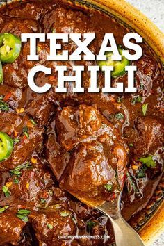 a bowl filled with chili beef and green peppers