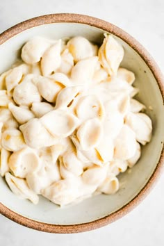 a bowl filled with dumplings on top of a table