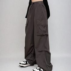 Looking for a versatile and comfortable pair of cargo pants? Check out our wide leg drawstring cuff pants! Made from a lightweight fabric, these pants are perfect for everyday wear. They feature an elastic waistline for a comfortable fit, and drawstring cuffs for a stylish touch. Whether you're running errands or taking a walk in the park, these pants will keep you feeling comfortable all day long.
Gender: WomenMaterial: PolyesterClothing Length: Full LengthWaist Type: Mid-WaistClosure Type: Elastic Waist Baggy Gray Cargo Pants With Elastic Waistband, Gray Wide Leg Cargo Pants With Elastic Waistband, Casual Baggy Parachute Pants With Drawstring, Casual Baggy Cargo Pants With Elastic Cuffs, Utility Wide-leg Cargo Pants With Drawstring, Casual Wide Leg Parachute Pants With Drawstring, Baggy Cotton Cargo Pants With Elastic Cuffs, Baggy High-waisted Cargo Pants With Drawstring, High-waisted Baggy Cargo Pants With Drawstring