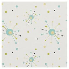 a white background with blue, yellow and green dots on it's surface is featured in this image