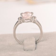 Ring details metal: silver/14k white(rose/yellow) gold center stone: Oval shape 7*9mm (1.79ct) Pink quartz accent stone: cz NOTE: if it is silver or white gold, it will be get plated with rhodium Customization is available you can change, add or remove any parts of the ring if you have good idea. I can add special engraving inside the shank of the ring by free (words, date, simply simbles and so on) too. I am happy to help out or make any adjustments to your order if you have a special request. Silver Moonstone Ring With Diamond Accents For Promise, Silver Morganite Rings With Diamond Accents, Rose Quartz Crystal Promise Ring, Silver Rose Quartz Crystal Ring, Round Rose Quartz Rings For Anniversary, Elegant Pink Moonstone Sterling Silver Ring, Rose Quartz Round Rings For Anniversary, Rose Quartz Anniversary Rings, Wedding Crystal Ring With Rose Quartz Gemstone