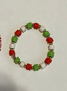 Christmas Colors (Red / Green / White) Bracelet made with Clay Beads with Gold Balls separating the colors. Multicolor Beaded Bracelets For Holiday, Adjustable Multicolor Bracelet For Holiday, Adjustable Multicolor Bracelets For Holiday, Adjustable Multicolor Stretch Bracelet For Holidays, Christmas Bracelets With Colorful Beads, Christmas Colorful Beads Bracelets, Christmas Multicolor Beaded Bracelets, Holiday Adjustable Beaded Bracelets With Colorful Beads, Festive Green Beaded Bracelets With Colorful Beads