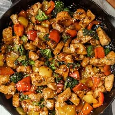 chicken stir fry with vegetables in a skillet