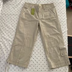 100% Cotton. Women’s Size 4 Capri Pants. Khaki Color. Never Worn With Tags Still On. 5 Pockets. New Condition. Short Cotton Cargo Pants For Spring, Casual Khaki Cotton Capris, Knee-length Capris With Pockets, Spring Short Pants With Pockets, Spring Knee-length Pants With Pockets, Spring Khaki Capris With Pockets, Summer Khaki Cotton Capris, Knee-length Khaki Cotton Bottoms, Summer Cotton Khaki Capris