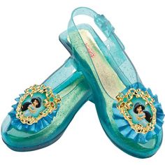 Inspired from the Disney movie, Aladdin, these adorable sparkling blue Jasmine shoes will have your child feeling like they just stepped out of a magical fairytale. Add the perfect finishing touch to your childs Arabian Princess character look. The Disney Princess Jasmine Sparkle shoes are sure to be a big hit with your little princess. The Disney Princess Jasmine Sparkle Child Shoes include one pair of sparkly blue sling-back costume shoes with adjustable strap and attached Jasmine character ca Jasmine Shoes, Disney Princess Shoes, Aladdin Costume, Edgy Boots, Disney Princess Costumes, Child Shoes, Dress Up Shoes, Aladdin Jasmine, Ariel Disney