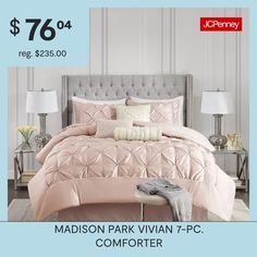 a bed with pink comforter and pillows on it for $ 76 00 reg $ 350 00