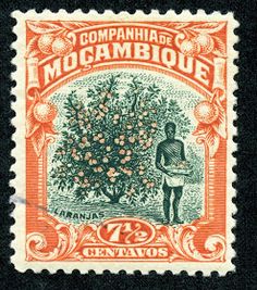 an orange and black stamp with a man standing next to a tree