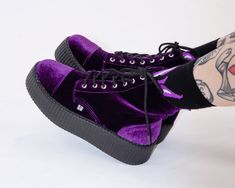 Walk right into a purple haze with these lush velvet boots. These cool creeper combat boots feature a vegan friendly purple velvet upper with a 7-eyelet lace up detail and a platform sole height that is about 1 ¾” at the heel and 1 ¼” in the front. Has removable memory foam insoles for added comfort and inside zipper closure for easy on/off. Purple Velvet Shoes, Shoes Purple Aesthetic, Dark Purple Shoes, Pink Boots Outfit, Platforms Boots, Creeper Boots, Y2k Boots, Goth Stuff, Purple Goth