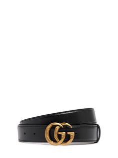 Width: 3cm. Black leather . Double G . Can be worn as a hip belt. Sizing will differ based on where the belt is worn, please refer to the size guide to find your size. . Adjustable pin closure. Gold-colored metal hardware. Logo details Gucci Leather Belt, Gg Belt, Hardware Logo, Hip Belt, Suede Belt, Gucci Leather, Gg Marmont, Monogrammed Leather, Gucci Black