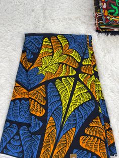 This  African Fabric is high quality African print made from 100% cotton and it's 45 inches wide. It is used for making African Clothing, African quilts, & For Home decoration. FYI: Print is Double sided. The listing is for 1, 6 yards and Headwrap Each piece of fabric measures:  36in by 45in for 1 yard 216in by 45in for 6 yards 72in by 22in for Head wrap If you purchase more than one yard, you will receive one continuous piece. *If you require more than what I have listed, feel free to send me email. CARE INSTRUCTIONS: *DO NOT BLEACH *Hand wash with cold water and mild soap or Dry clean *Press with hot iron for a crispy look. Color may be different due to your monitor Ankara Fabric With Abstract Pattern, Ankara Fabric With Vibrant Print, African Quilts, Clean And Press, African Textiles, African Prints, Ethnic Print, African Print Fabric, Ankara Fabric