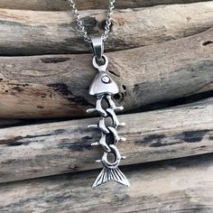 "925 Sterling Silver Fish Bone Skeleton Pendant Necklace. Pendant size: 1.57\" x 0.39\" (40x10 mm) 925 Sterling Silver Chain, 18\"(45cm), 20\"(50cm), 22\" (55cm) or 18\"(45cm) 2.5mm Black Leather Cord with a lobster clasp + extender (+1.96\"in / +5cm) included. Please choose your desired necklace length from the drop-down menu when placing the item in your shopping cart. Also you can add charms and personalize your necklace: http://etsy.me/2x6JVSr For more Fish Bone Skeleton Necklace: http://ets Sterling Silver Fish-shaped Jewelry Gift, Sterling Silver Fish-shaped Jewelry As Gift, Sterling Silver Fish-shaped Necklace With Lobster Clasp, Fish-shaped Metal Jewelry As A Gift, Fish-shaped Metal Jewelry For Gifts, Silver Necklaces With Fish Hook For Gift, Silver Necklace With Fish Hook Clasp Gift, Skeleton Necklace, Fish Pendant Necklace