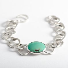 The "Laredo" Turquoise bracelet is handmade from 925 sterling silver (92.5% pure silver) in my workshop. It features a beautiful Natural Green Turquoise gemstone. Green Turquoise cabochon. Weight: 6.04 ct. Size: 19.75x16.01x2.51 mm Each link of the bracelet has been hand formed separately. Each link is soldered to the next one to form a finished bracelet. The whole bracelet is then polished by hand. The bracelet attaches with a handmade sterling silver hook clasp. Being hand formed, each link is Earth Mined Turquoise Jewelry Sterling Silver, Luxury Sterling Silver Cabochon Bracelets, Luxury Unique Turquoise Sterling Silver Bracelet, Handmade Turquoise Sterling Silver Bracelets, Unique Turquoise Sterling Silver Bracelets, Artisan Turquoise Sterling Silver Bracelet, Turquoise Sterling Silver Bracelet, Turquoise Sterling Silver Oyster Bracelet, Sterling Silver Turquoise Oyster Bracelet