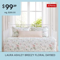 a white daybed with floral bedding and pillows on it for $ 99 95 reg $ 85 00