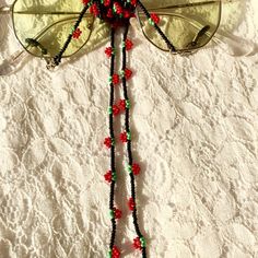 This handmade cute strawberry glasses chain is carefully hand-woven from glass seed beads. Unique tiny strawberry eyeglasses necklace is a womens sunglass strap that is compatible with all your combinations and can be used in all seasons.   Lenght 80 cm 31.5 in                                                                                                                                       Cute strawberry accessory chain is a trendy gift for you and your loved ones. Guaranteed to receive all Adjustable Black Beaded Necklace For Summer, Summer Party Glass Necklaces, Adjustable Glass Beaded Necklaces For Party, Summer Glasses Chains With Colorful Beads As Gift, Colorful Beads Glasses Chains As Summer Gift, Handmade Casual Glass Jewelry, Handmade Adjustable Glasses Chains With Round Beads, Adjustable Glass Beaded Necklaces With Tiny Beads, Adjustable Glass Beaded Necklace With Tiny Beads