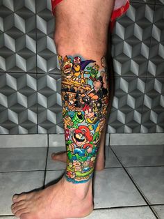 a man's leg covered in cartoon characters on the side of his body,