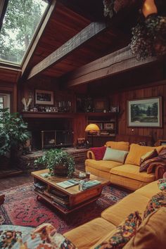 a living room filled with furniture and a fire place in the middle of a room