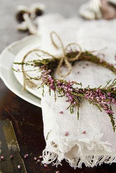 a white plate topped with a napkin covered in flowers