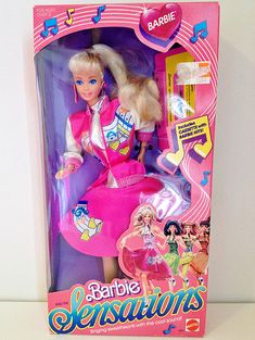 the barbie doll is in its pink box