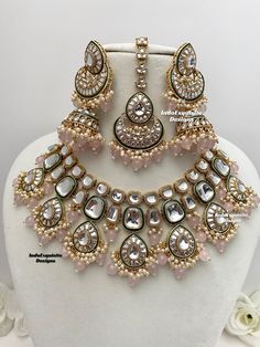 Premium quality Kundan Necklace comes with elegant Jhumki Earrings and Tikka/ trendy Indian bridal set/Premium Quality Polki and Kundan Jewelry/pink All items are shipped from Brampton, Ontario, Canada. If you need your item by a certain day, please reach out to us for express delivery option before placing the order so that we can update the shipping for you. Standard shipping/delivery timeline Below are the delivery timeline estimates. We dispatch all orders by the next business day. ---> USA Pink Kundan Necklace For Reception In Temple Jewelry Style, Pink Heavy Temple Jewelry Bridal Necklace, Heavy Pink Temple Jewelry Bridal Necklace, Pink Kundan Necklace For Festive Reception, Pink Chandbali Bridal Necklace For Festivals, Festive Pink Kundan Necklace For Reception, Pink Temple Jewelry Bridal Necklace For Reception, Pink Hand Set Bridal Earrings For Wedding, Festive Pink Bridal Sets With Stone Work