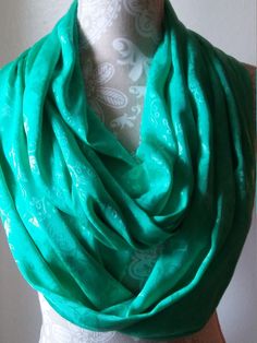 "Spruce up any outfit with this gorgeous light weight scarf. This scarf is emboss with roses and is a sea green color.  Dress up or down... Perfect accessory ! and ready to ship. This super soft scarf will get you lots of compliments Super loop can be wrapped up to 3 times Length:72\" Loop Width: 12\" 24\" circumference polyester  Fabric Hand wash in cool water, Hang dry" Elegant Green Scarf, One Size, Olive Scarf, Light Weight Scarf, Spring Shawl, Eternity Scarf, Sea Green Color, Chunky Knit Scarves, Women Scarves, Brown Scarves