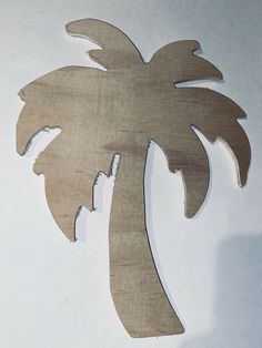 a wooden cutout of a palm tree