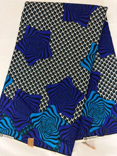 "Material: 100% cotton TOP QUALITY FABRIC Print: DOUBLE-sided  Width: 45\" This timeless appeal & adorable African print is perfect for making African Clothing, African Quilts, Upholstery, Home Décor, and unique accessories. FABRIC CUT:        Purchase of 1+ yards per customer will be cut as 1 continuous  piece of fabric up to a maximum length of 6 yard. LABELS: All African fabric is sold with an adhesive Manufacturer label attached. Create your unique one of a kind piece. Get it today.  Each pi Blue African Print, Hair Salon Chairs, African Quilts, School Kit, African Fabrics, African Ankara, Salon Chairs, Unique Accessories, African Print Fabric