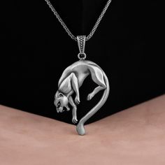 Elegant Black Panther Shaped Pendant in 925 Sterling Silver, Realistic Animal Jewelry, 3D Panther Pendant, Birthday and Anniversary Gift Made of 925 silver and handcrafted by hand, this ring is not only an accessory piece that complements your daily elegance, but also has details that will reflect your character and style. It is also a great gift to give to your loved ones on their special days. At SavisSilver, we always give importance to the satisfaction of our customers, we recommend you to r Black Panther Necklace, Panther Necklace, Animal Jewelry, Black Panther, Panther, Silver Fashion, Anniversary Gift, Band Rings, Solid Gold